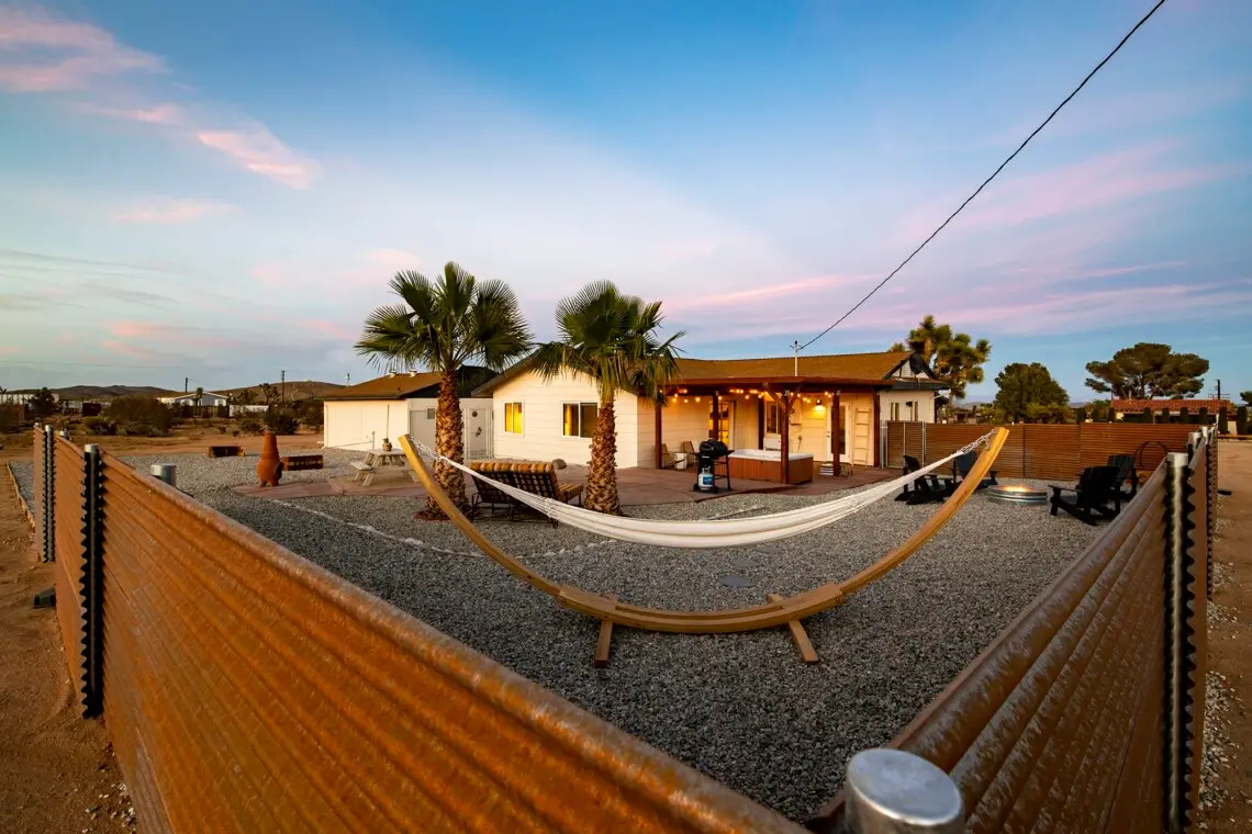 The Yucca House with hammocks and palm trees