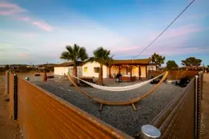 The Yucca House with hammocks and palm trees