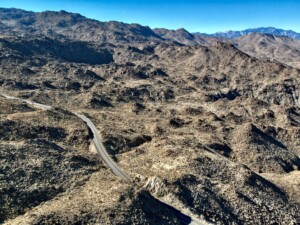 Desert landscape with mountains and winding road