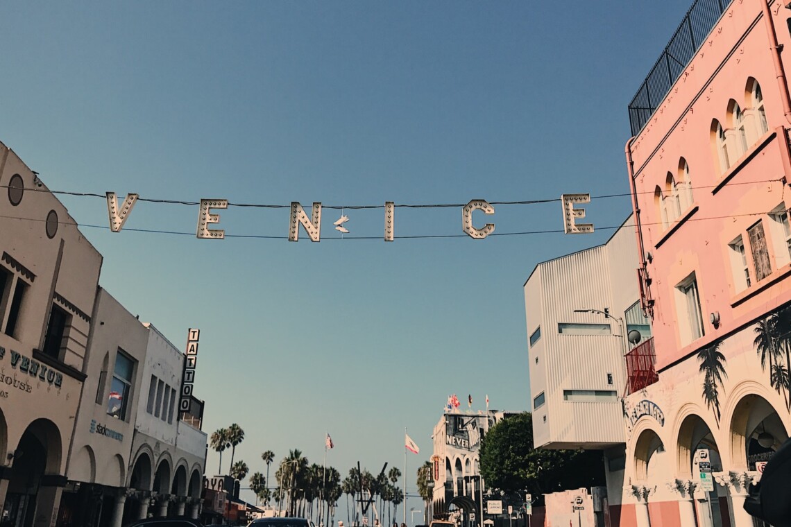 Street scene in Venice with a sign that reads VENICE