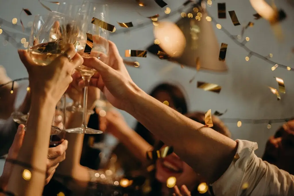 Bachelorette party celebration with friends clinking glasses, captured in a festive atmosphere - Open Air Homes
