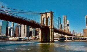 Brooklyn Bridge with the Manhattan skyline in the background on a clear day - Part 4: The Evolving Landscape of Rentals: New York’s Opportunity to Embrace Month+ Stays - by Open Air Homes