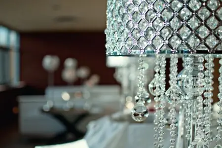 Close-up of a crystal chandelier with a blurred background – by Open Air Homes.