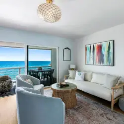 Living room with ocean view at Breathe Malibu - Ocean Front Condo w/ Beach Access - by Open Air Homes