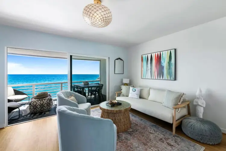 Living room with ocean view at Breathe Malibu - Ocean Front Condo w/ Beach Access - by Open Air Homes