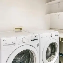 Laundry area with washer and dryer at Breathe Malibu - Ocean Front Condo w/ Beach Access by Open Air Homes.