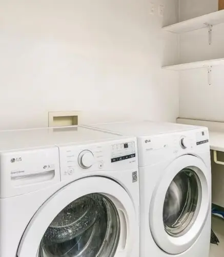 Laundry area with washer and dryer at Breathe Malibu - Ocean Front Condo w/ Beach Access by Open Air Homes.