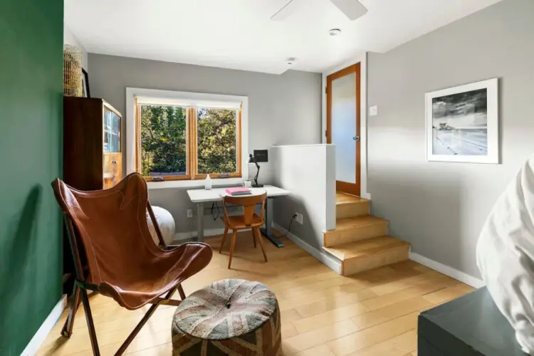 Room with desk, chair, and window view at Hillside Hideaway in Topanga Canyon - by Open Air Homes