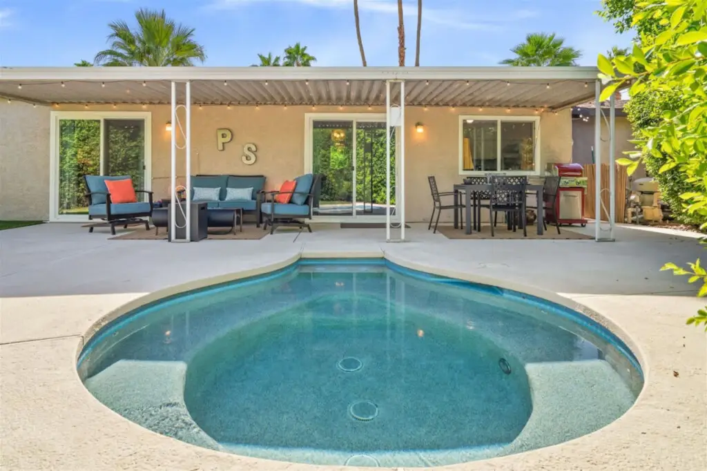 The Blue Door Bungalow - Your Private Palm Springs 6 Outdoor area with pool and seating in City Lights Loft backyard – Open Air Homes.