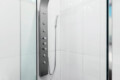 Shower with a modern shower panel and glass enclosure at Ocotillo, Palm Springs