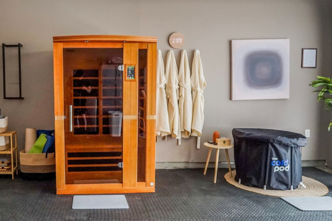 Wellness room with wooden sauna, cold plunge pool, and robes at Ocotillo, Palm Springs