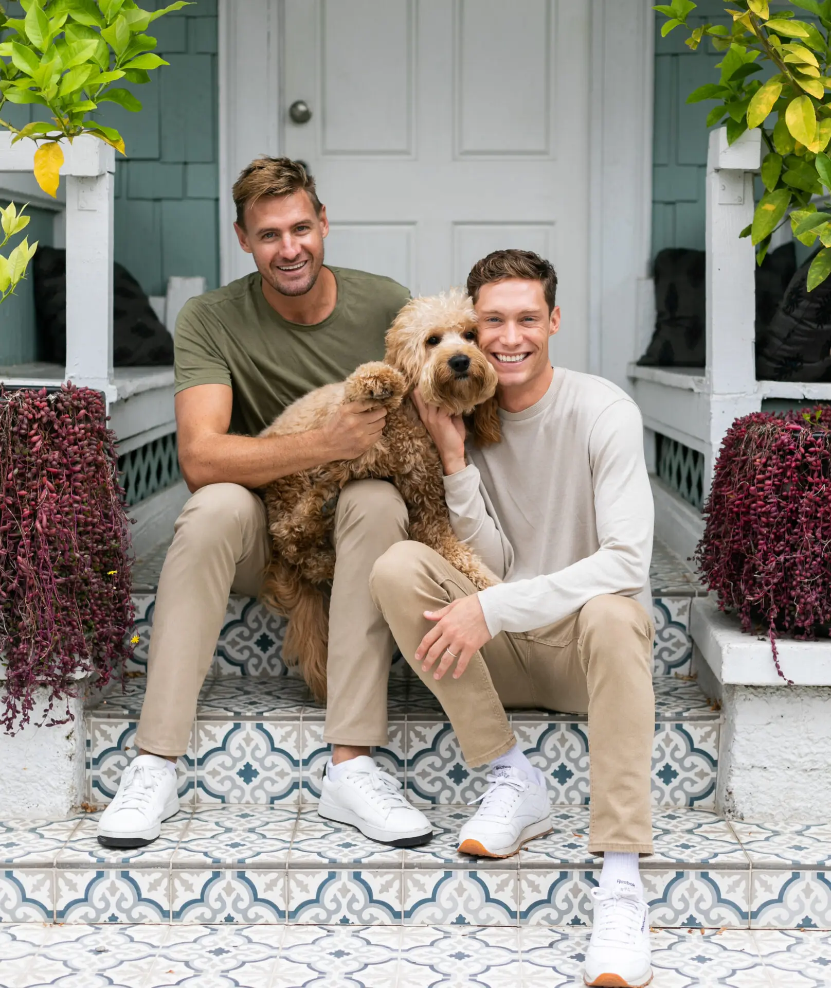 Brad Greiner and Julien Marbot holding their dog