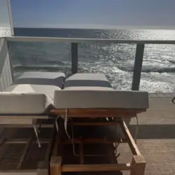 Patio area with lounge chairs overlooking the ocean at Malibu Breeze.