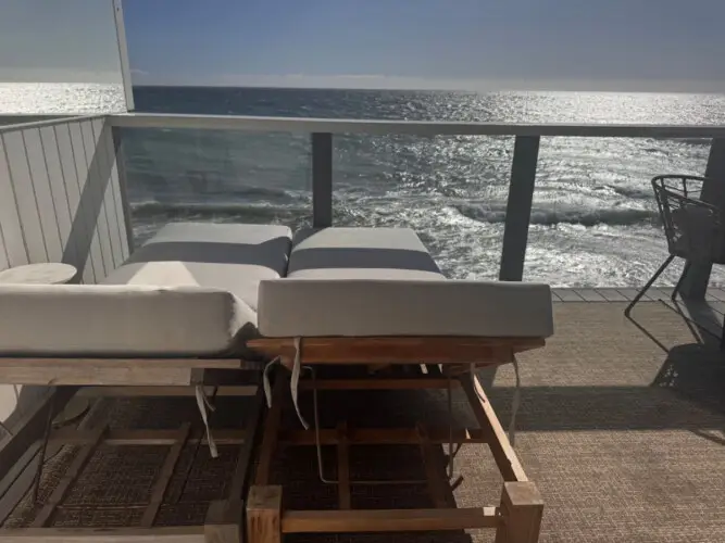 Patio area with lounge chairs overlooking the ocean at Malibu Breeze.