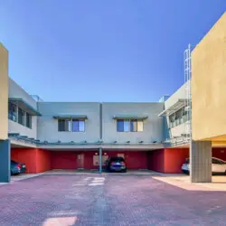 Parking area at La Mirage in Palm Springs by Open Air Homes, with multiple parking spots available – by Open Air Homes.