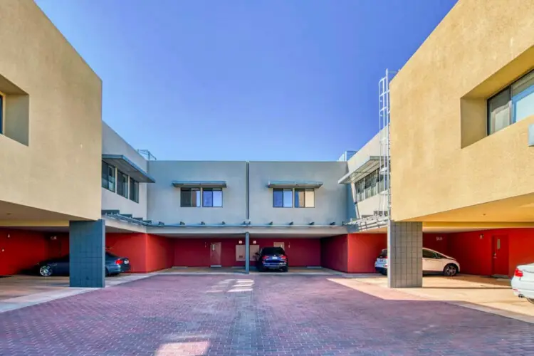 Parking area at La Mirage in Palm Springs by Open Air Homes, with multiple parking spots available – by Open Air Homes.