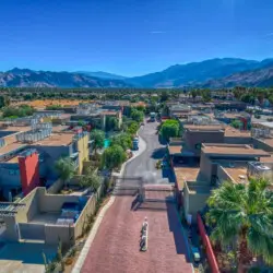 Aerial view of La Mirage, a gated community with modern homes and stunning mountain views in Palm Springs – by Open Air Homes.