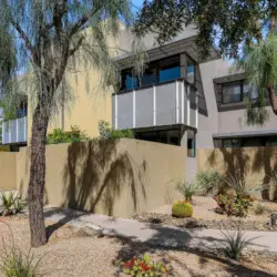 Exterior of a modern home at La Mirage gated community in Palm Springs, showcasing contemporary design – by Open Air Homes.