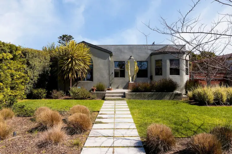 Exterior of house with gray facade and walkway