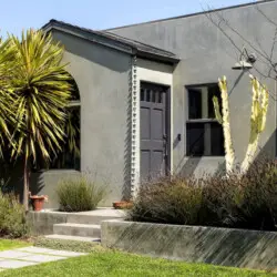 Exterior view of Sun-Drenched Spanish Manor in Mar Vista with modern design and landscaping - by Open Air Homes.