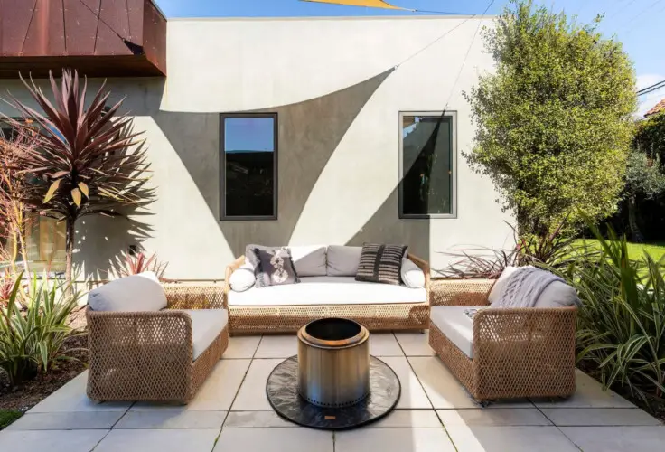 Outdoor seating area with fire pit at Sun-Drenched Spanish Manor in Mar Vista - by Open Air Homes.