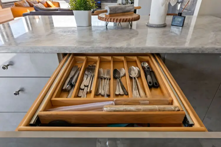 Kitchen drawer with utensils at Skyline View Loft with Chef's Kitchen: DTLA - by Open Air Homes.