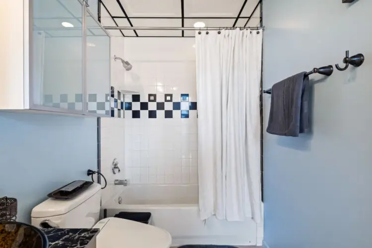 Bathroom with shower and toilet at Skyline View Loft with Chef's Kitchen: DTLA - by Open Air Homes.