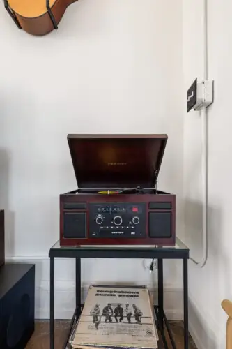 Record player at Skyline View Loft with Chef's Kitchen: DTLA - by Open Air Homes.