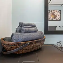 Basket of towels in a bathroom setting