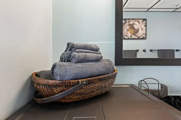 Basket of towels in a bathroom setting