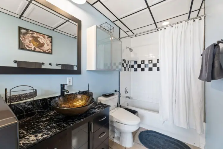 Bathroom with shower and toilet at Skyline View Loft with Chef's Kitchen: DTLA - by Open Air Homes.