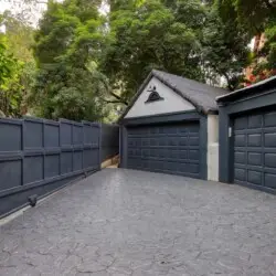 Driveway leading to garage at Laurel Canyon Classic Hollywood Residence with Pool by Open Air Homes.