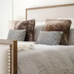 Luxurious bed with decorative pillows at Laurel Canyon Classic Hollywood Residence W/ Pool by Open Air Homes.