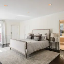 Spacious bedroom with natural light and elegant decor at Laurel Canyon Classic Hollywood Residence W/ Pool by Open Air Homes.