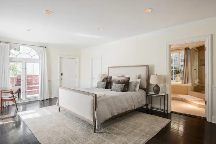 Spacious bedroom with natural light and elegant decor at Laurel Canyon Classic Hollywood Residence W/ Pool by Open Air Homes.