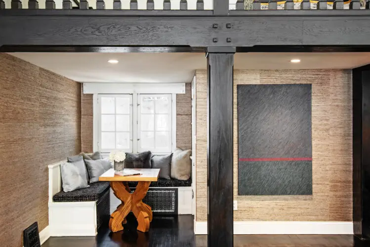 Cozy seating area in Laurel Canyon Classic Hollywood Residence W/ Pool featuring a built-in bench, cushions, and a small table by Open Air Homes.