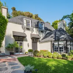 Exterior of Laurel Canyon Classic Hollywood Residence W/ Pool featuring a well-maintained lawn, paved walkway, and classic facade by Open Air Homes.