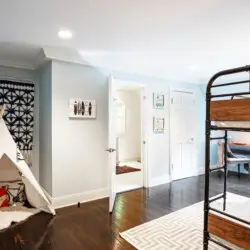 Bedroom interior of Laurel Canyon Classic Hollywood Residence W/ Pool featuring a bunk bed, small tent, and play area by Open Air Homes.