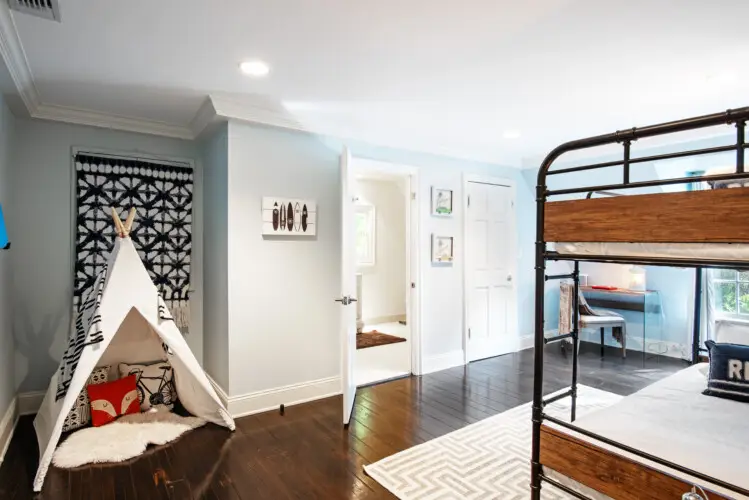 Bedroom interior of Laurel Canyon Classic Hollywood Residence W/ Pool featuring a bunk bed, small tent, and play area by Open Air Homes.