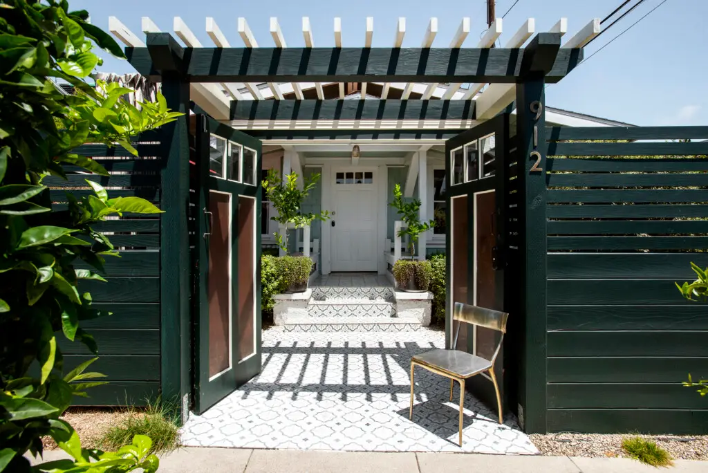 Airbnb Average Length of Stay - Entrance of a Venice Beach bungalow with open gate, pathway, and front door - Open Air Homes monthly rental.