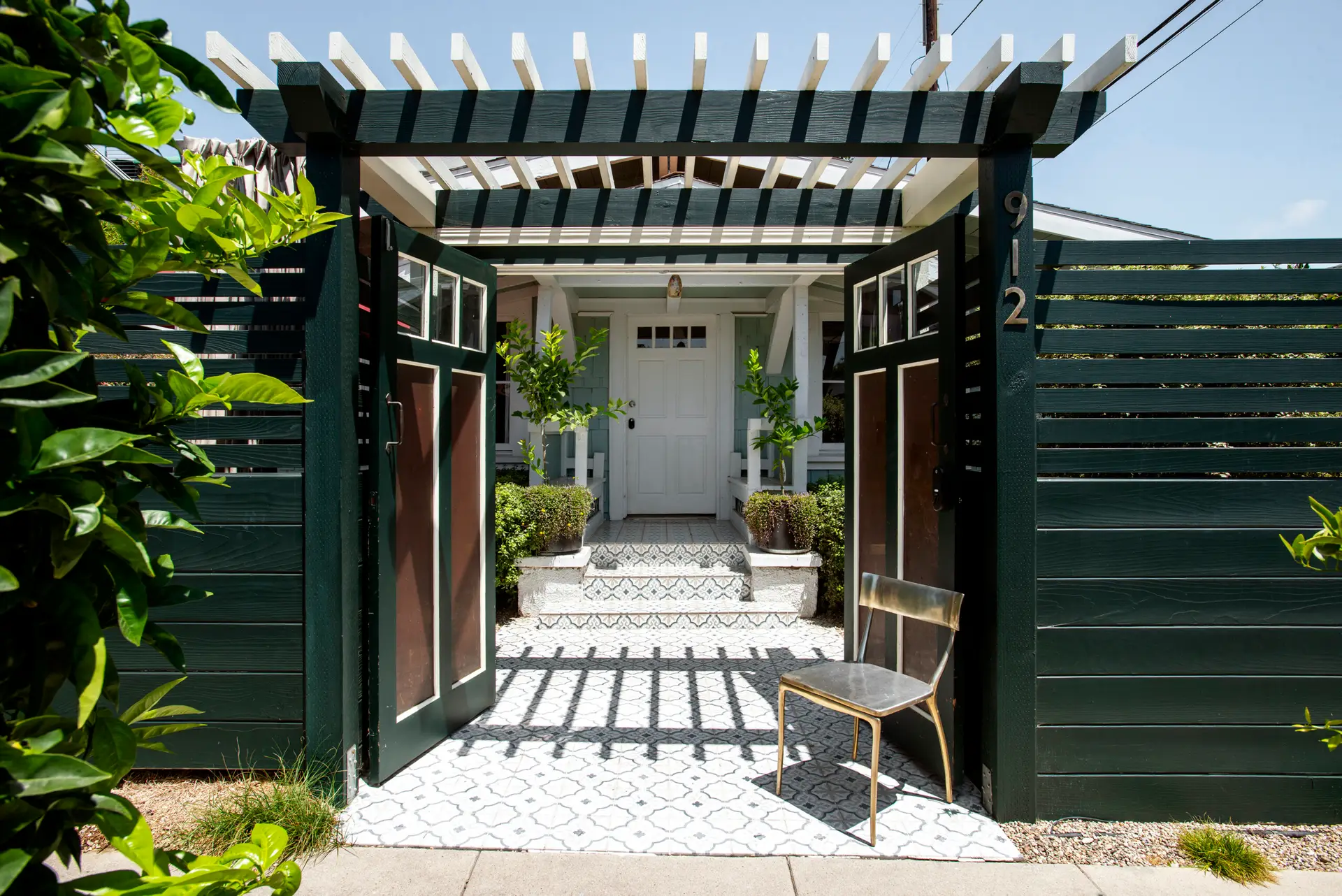 Airbnb Average Length of Stay - Entrance of a Venice Beach bungalow with open gate, pathway, and front door - Open Air Homes monthly rental.