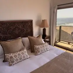 Bedroom in Redondo Beach rental with ocean view and sliding glass door.