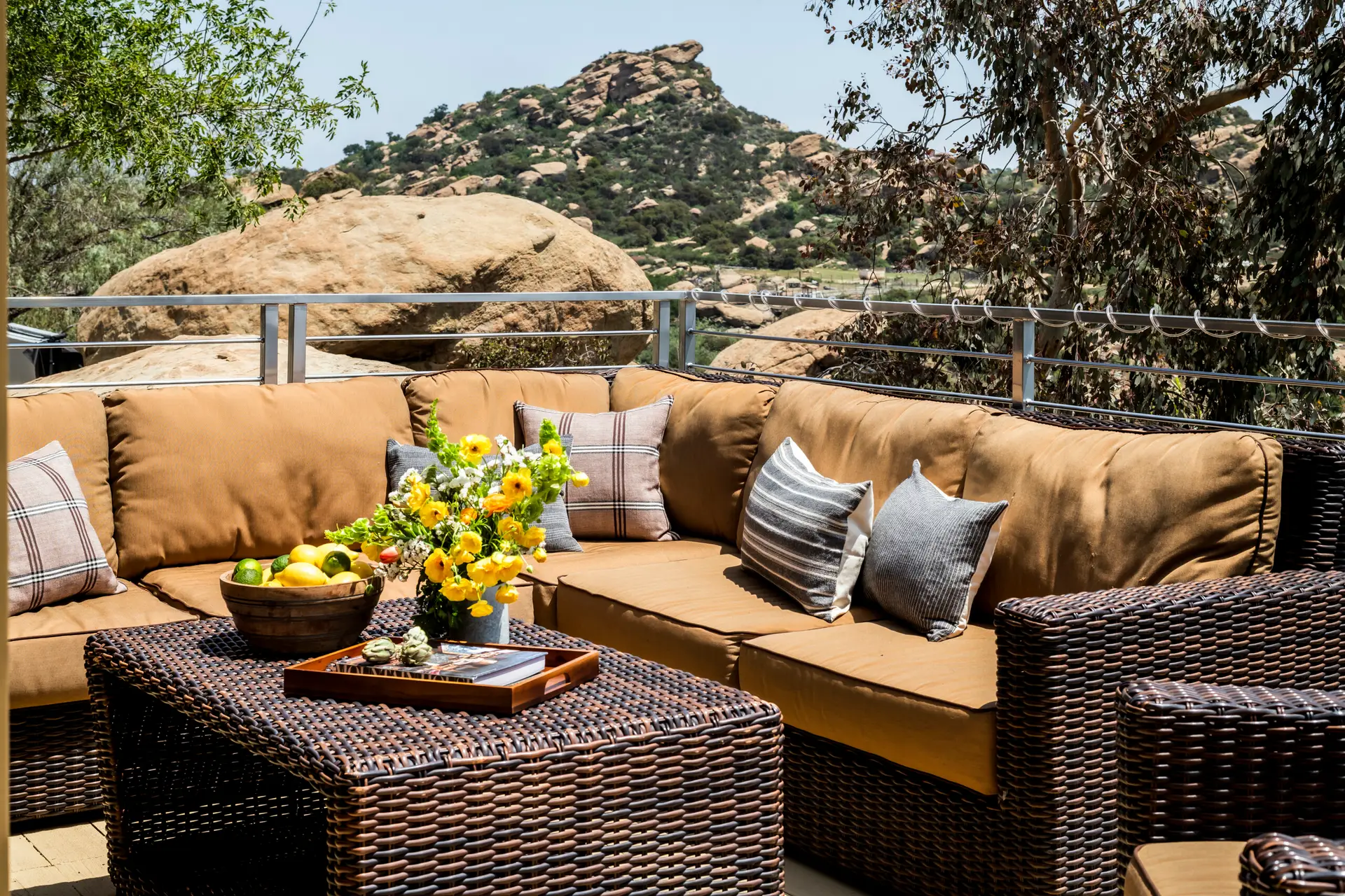 Outdoor seating area with couch and coffee table at Retreat to the Rocks, Studio Road, Ventura County