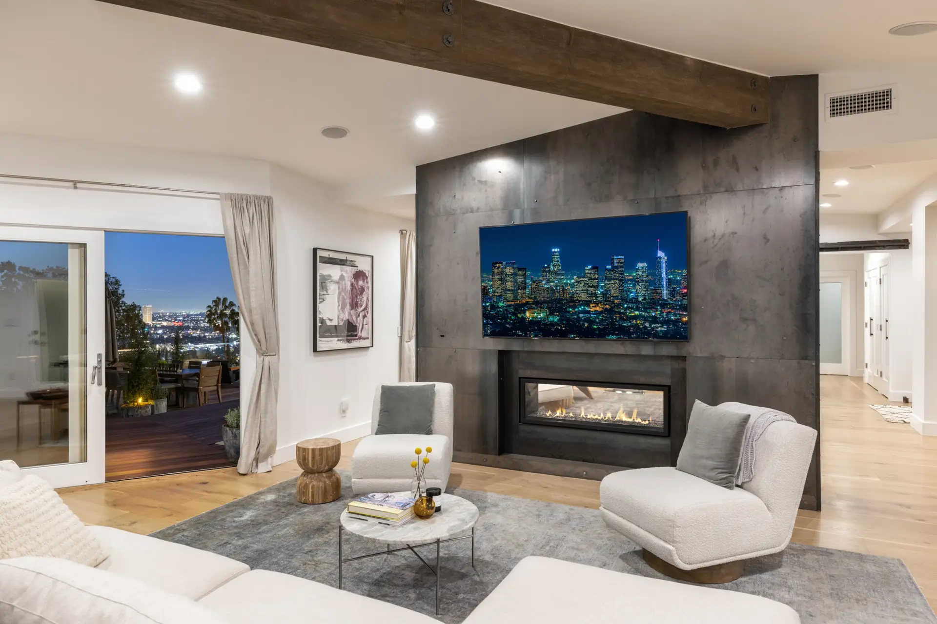 Eagle Rock Airbnb Management - Modern living room with city view and outdoor deck access in Hollywood Hills Home - Open Air Homes