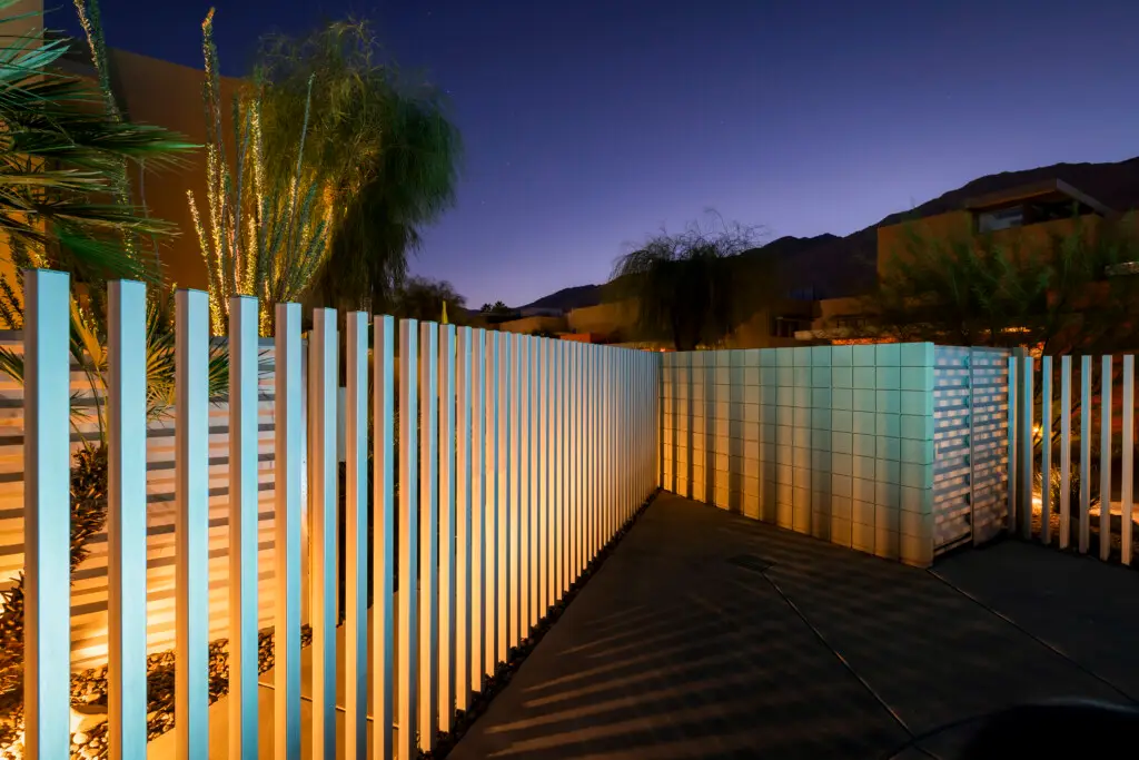 Outdoor area with modern fence and lighting at Sunset Sands, Palm Springs monthly rental