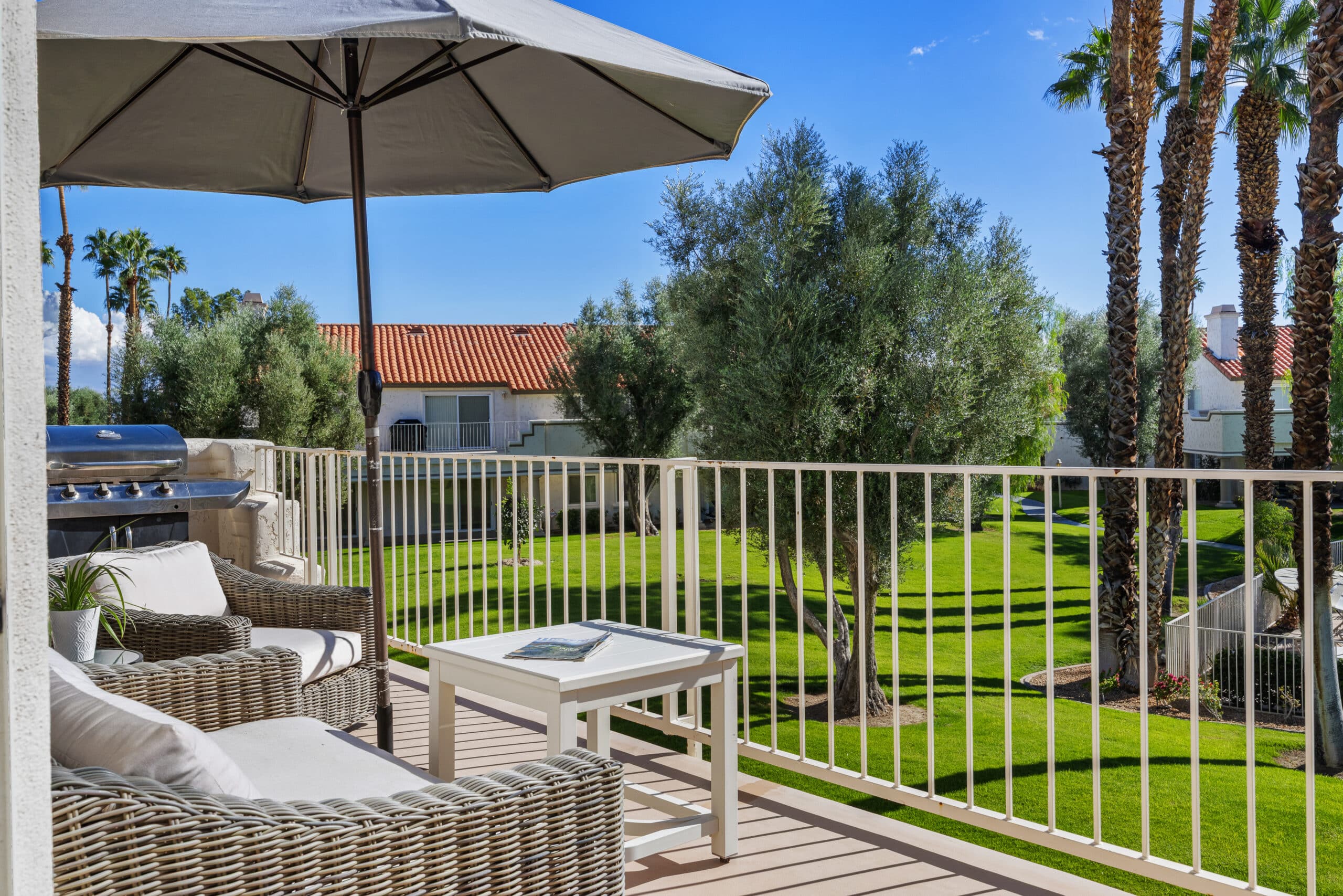 Desert Falls patio with new wicker furniture and grill
