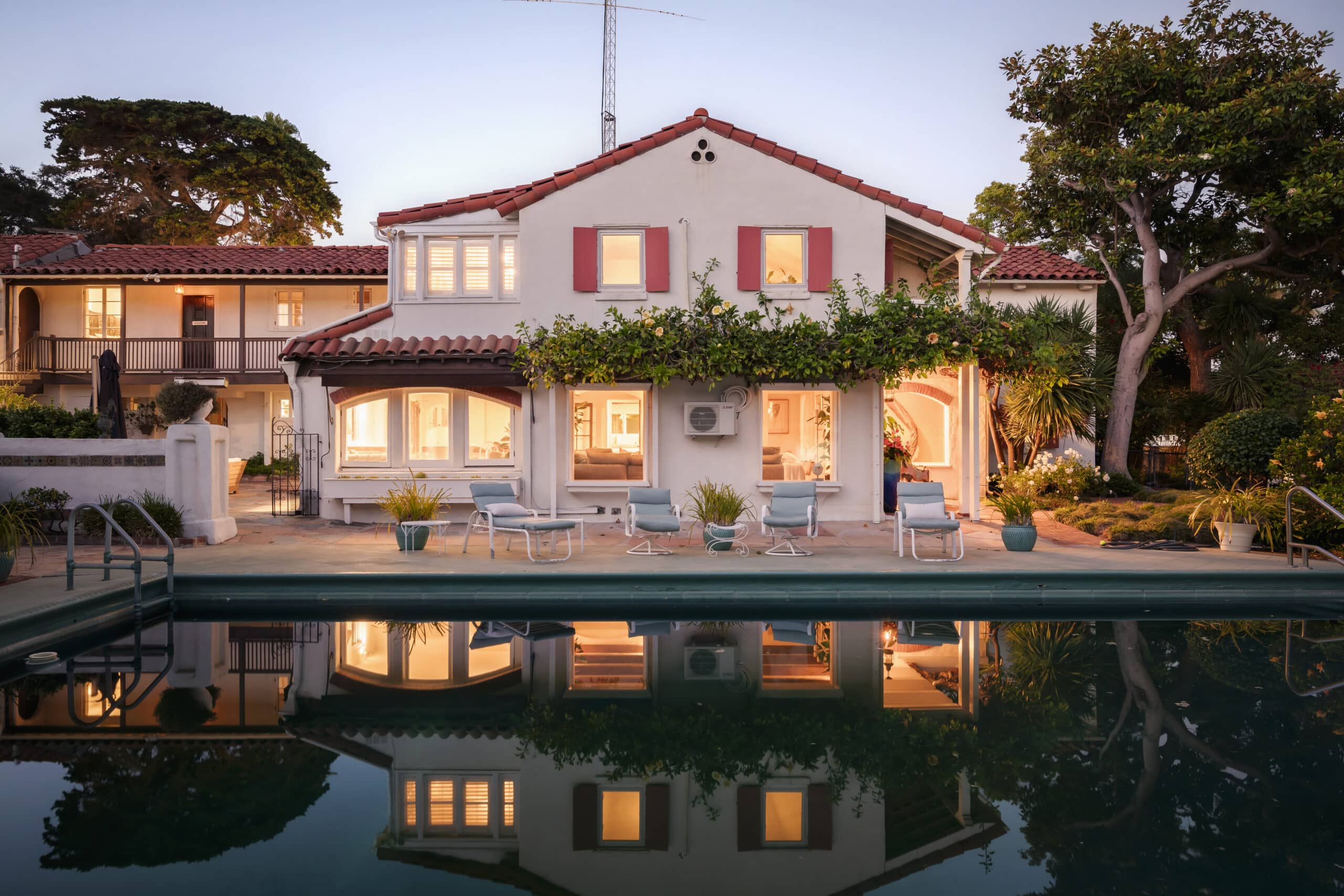 071 5 Bedroom Pacific Palisades Estate Spanish Facade Mirrored in the Evening Pool 1 scaled