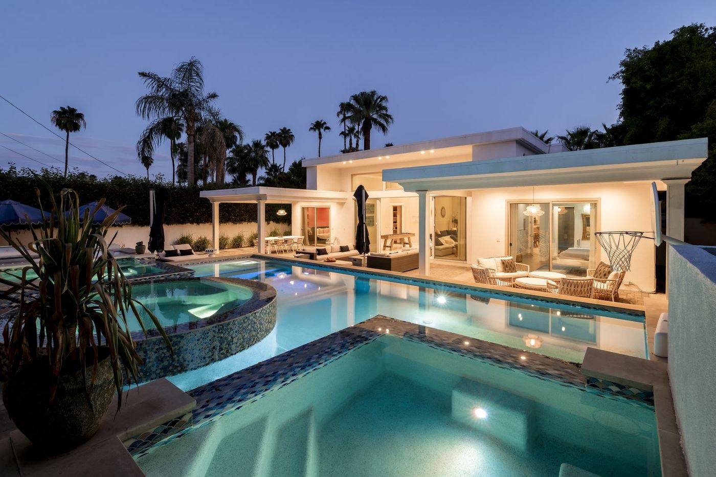 Vacation rental renovation ROI in Palm Springs: pool and spa at twilight after the refresh