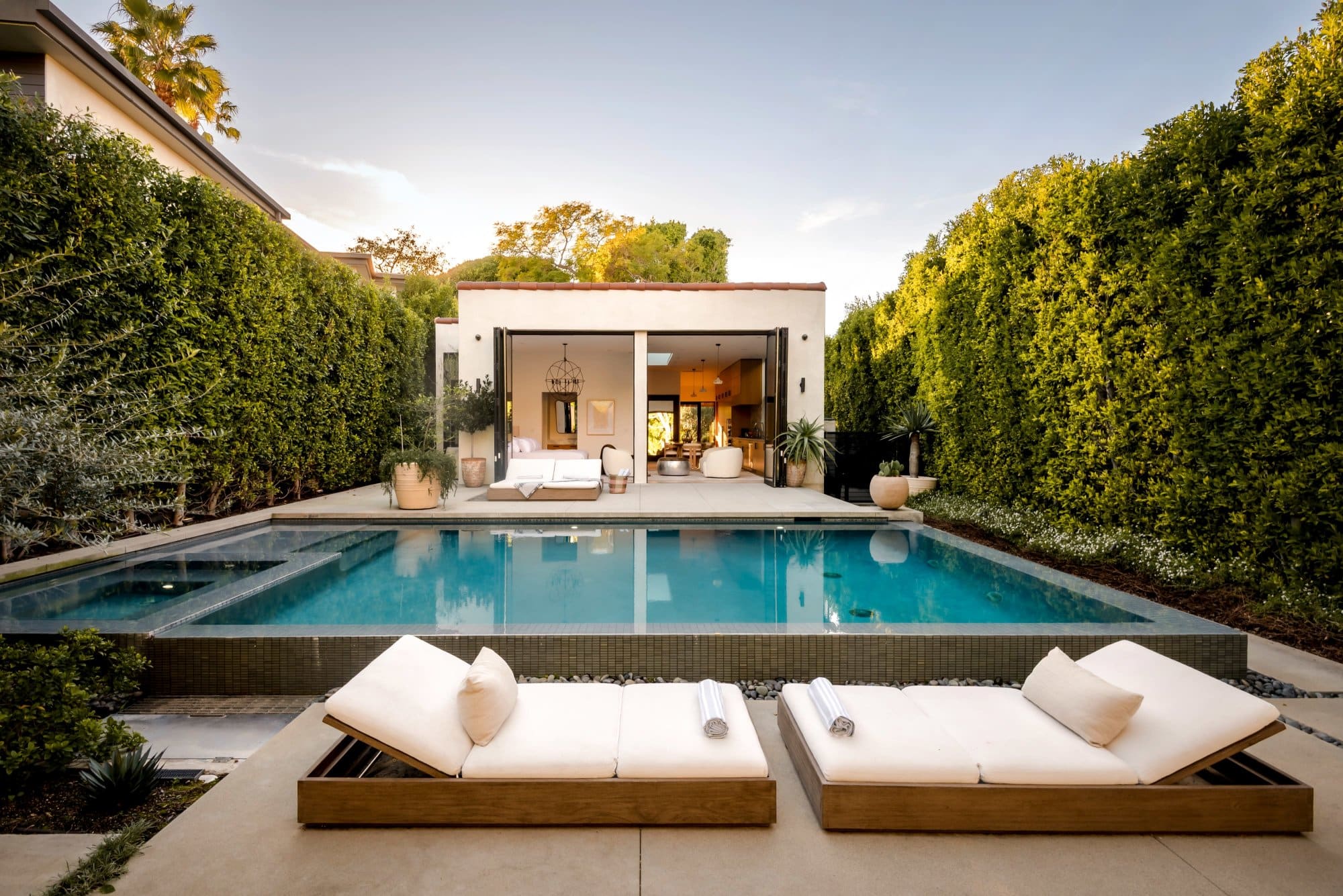 West Hollywood production location, pool and pool house with loungers