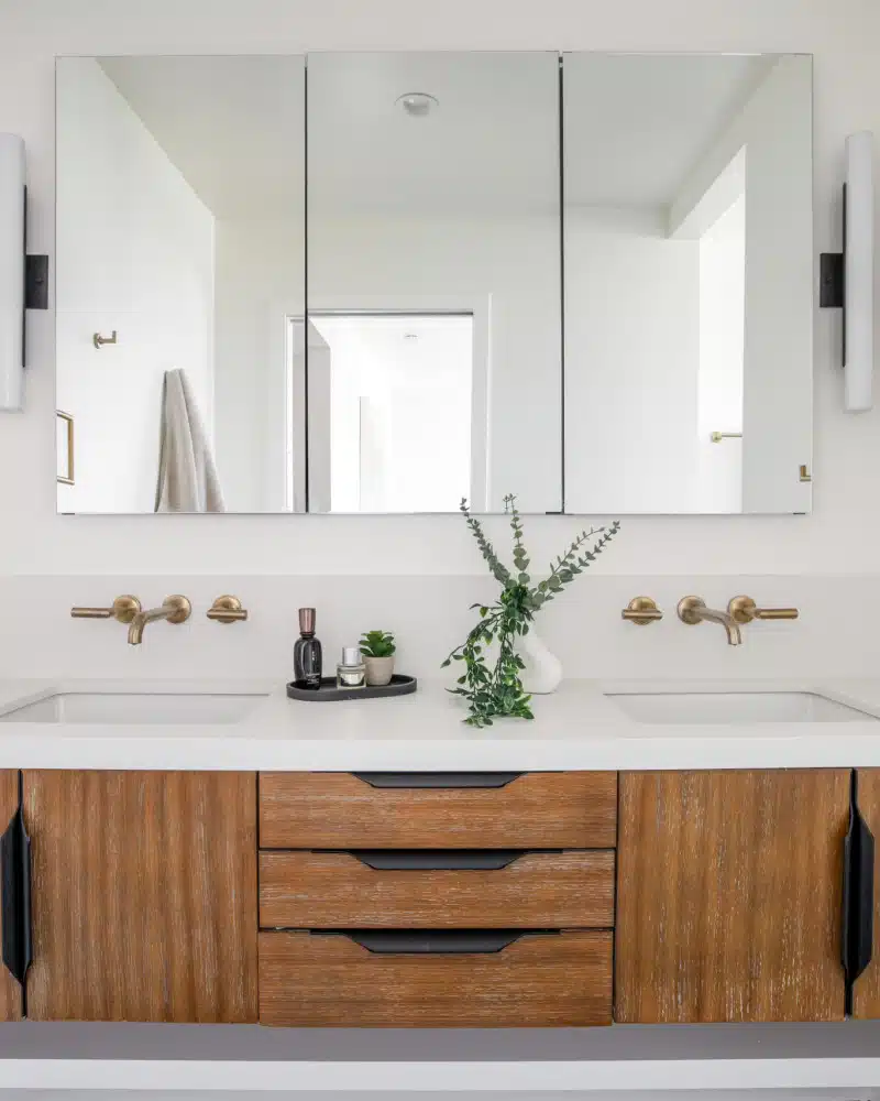 Modern bathroom vanity with dual sinks and wooden cabinet at Pacific Ave short-term rental, Venice Beach.